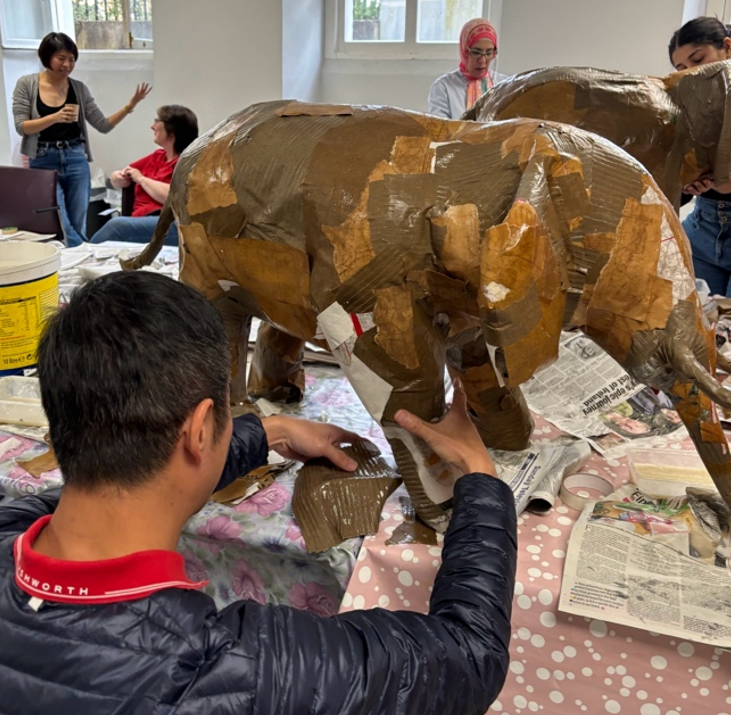 making an elephant with paper, hands into action