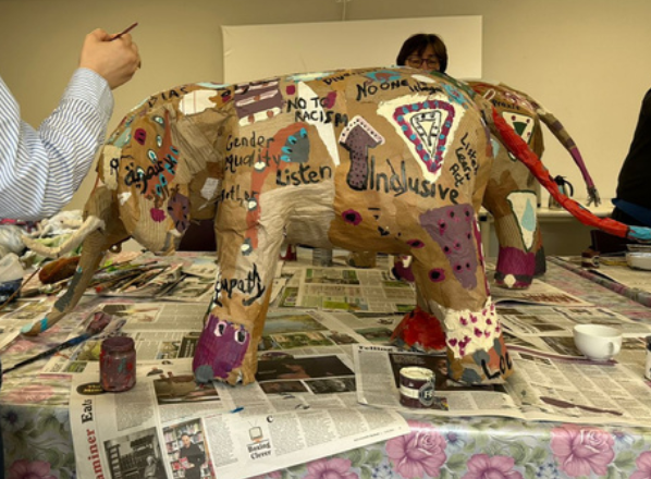 painting a paper elephant